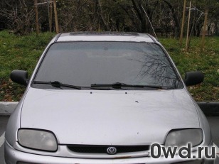 Битый автомобиль Mazda 323